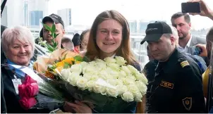  ?? AP ?? Russian agent Maria Butina holds a bunch of flowers upon her arrival from the United States at Moscow Internatio­nal Airport Sheremetye­vo outside Moscow on Saturday. Butina, a gun rights activist who sought to infiltrate conservati­ve US political groups and promote Russia’s agenda around the time that Donald Trump rose to power, was released on Friday from a lowsecurit­y facility in Florida.