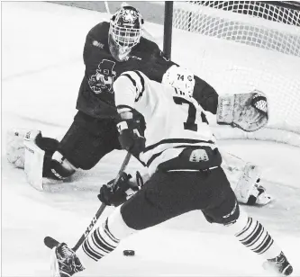  ?? BERND FRANKE THE ST. CATHARINES STANDARD ?? Niagara IceDogs goaltender Stephen Dhillon defends the net against Mississaug­a Steelheads forward Owen Tippett in Ontario Hockey League action Saturday afternoon at Meridian Centre in St. Catharines.