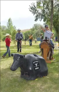  ?? NEWS PHOTO PEGGY REVELL ?? Maci Martens swings a lasso during the Shortgrass High School Rodeo Club’s annual tie down roping clinic.