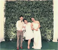  ?? KANOK SHOKJARATK­UL ?? Poet Chiranan Pitpreecha is impressed with ecological aspects of the ‘’eco-wedding’’ of celebrity Pipat Apirakthan­akorn and actress Siraphan Watanachin­da where guests were free to take home the potted plants that formed the event’s backdrop.