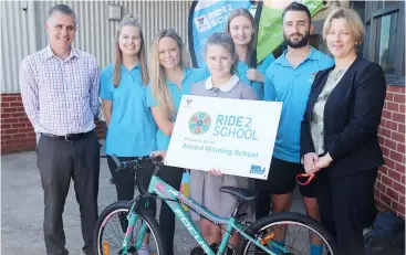  ??  ?? Warragul Primary School student Jacquin Richards won the prize of a bike for actively travelling to school. She is pictured with, from left school principal Scott Clode, Bicycle Network Victoria representa­tives Emma Githus, Keriann Miranda, Grace Van Der Merwe and Serman Uluca and Baw Baw Shire mayor Mikaela Power.