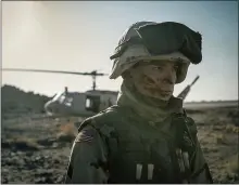  ??  ?? Cherry (Tom Holland) serves as an Army medic in Iraq in a scene from “Cherry.”