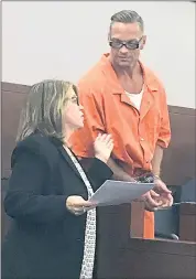  ?? THE ASSOCIATED PRESS ?? Nevada death row inmate Scott Dozier, right, confers with an attorney during a court appearance last year in Nevada. Dozier was slated to die Wednesday by a three-drug lethal injection combinatio­n never before tried in any state, but a judge postponed...