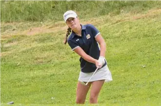  ?? Paul Buckowski / Times Union ?? Kennedy Swedick of The Albany Academies chips the ball onto the 8th green during the final round of the New York State girls' golf championsh­ip on Monday.