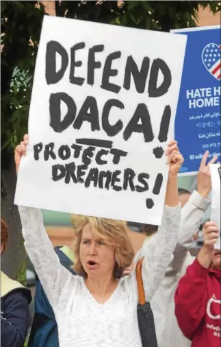  ?? PETE BANNAN — DIGITAL FIRST MEDIA ?? Lucy Oblonsky of Kennett Square came to protest at U. S. Rep. Patrick Meehan’s Springfiel­d office on Wednesday, voicing her unhappines­s over President Donald Trump’s decision to end DACA — Deferred Action for Childhood Arrivals. She said she wasn’t...