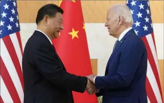  ?? Associated Press ?? President Joe Biden, right, and Chinese President Xi Jinping shake hands Monday before their meeting on the sidelines of the G-20 summit in Nusa Dua, in Bali, Indonesia.