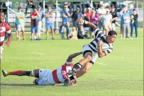  ?? Picture: SIBONGILE NGALWA ?? TACKLED: An attacking Selborne College player is held up against Hudson Park