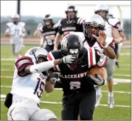  ?? Bud Sullins/Special to Siloam Sunday ?? Siloam Springs junior Primo Agbehi, left, and senior Marquan Sorrells try to bring down Pea Ridge running back Drew Winn during Tuesday’s scrimmage at Blackhawk Stadium. Winn rushed for 177 yards on six carries in the two-quarter scrimmage.