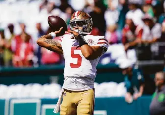  ?? Matt Rourke / Associated Press ?? Quarterbac­k Trey Lance warms up before the 49ers’ game against the Eagles, but the rookie didn’t play a down. The No. 3 pick played four snaps in San Francisco’s season opener.