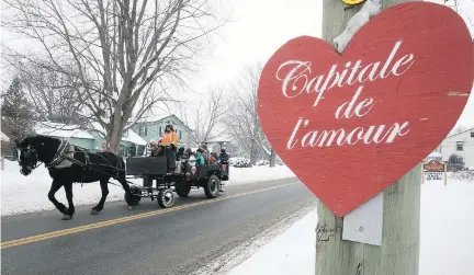  ?? PIERRE OBENDRAUF ?? A calèche makes its way down main street in St-Valentin on Saturday. The town calls itself The Capital of Love.