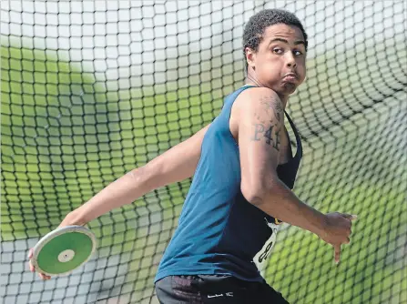  ?? PETER LEE WATERLOO REGION RECORD ?? Terrell Webb of St. Benedict Catholic Secondary School in Cambridge makes a throw in the senior boys’ discus.