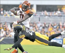  ?? Matt Freed/Post-Gazette ?? Joe Haden cuts down Cincinnati’s Brandon LaFell in the first quarter.