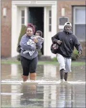  ?? TIMOTHY D. EASLEY/ASSOCIATED PRESS ?? Simone Wester, 20, and her 7-month-old son, Jeremiah, were rescued from their Louisville apartment by Kevin Mansfield.