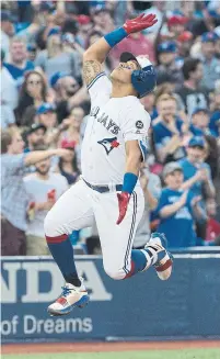  ?? RICK MADONIK/TORONTO STAR ?? Blue Jay Yangervis Solarte soars home after the first of his two long balls in Friday night’s win over the Nationals.