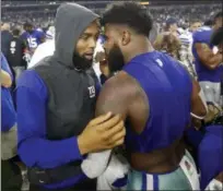  ?? MICHAEL AINSWORTH — THE ASSOCIATED PRESS ?? The New York Giants' Odell Beckham Jr., left, and the Dallas Cowboys' Ezekiel Elliott, right, greet each other at midfield after an NFL football game, Sunday in Arlington, Texas.