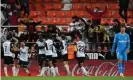  ?? ?? Hugo Duro celebrates his dramatic late equaliser for Valencia at home to Atlético Madrid. Photograph: Pressinpho­to/Shuttersto­ck