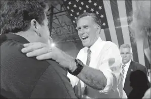  ?? By Mary Altaffer, AP ?? “Appreciati­ve”: Mitt Romney greets supporters Tuesday at the Somers Furniture warehouse in Las Vegas. The Texas primary gave him the delegates he needed to clinch the Republican nomination.