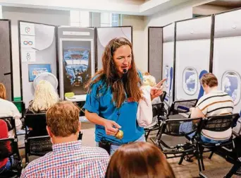  ?? Shafkat Anowar/Dallas Morning News ?? Hollis Owens, founder and executive director of To Be Like Me, leads a flight simulation activity designed as a sensory processing challenge at the nonprofit’s community open house event.