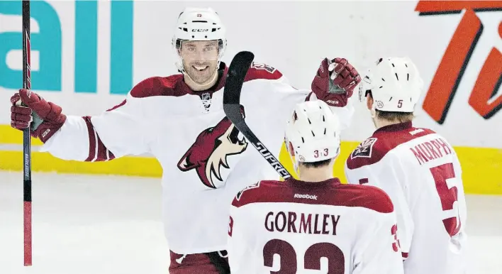  ?? Jason Franson/The Canadian Press/file ?? Arizona Coyotes’ Sam Gagner celebrates a goal against the Edmonton Oilers with Connor Murphy, right, and Brandon Gormley during an NHL game at Rexall Place on Dec. 23.