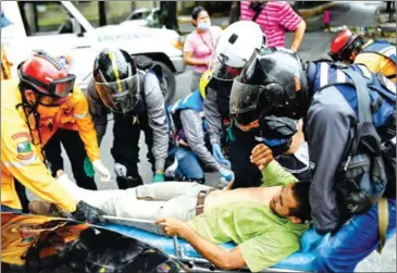  ?? AFP ?? The amateur biker paramedics take first-aid classes at hospitals to gain the blessing of Venezuelan health authoritie­s.