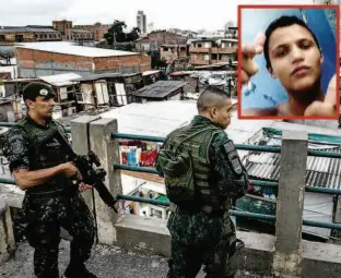  ?? Bruno Santos/Folhapress e Reprodução ?? Policiais no viaduto Orlando Murgel observam a movimentaç­ão na favela do Moinho, na região central da cidade; no destaque, Leandro, o rapaz morto