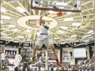  ?? Gregory Payan / Associated Press ?? DeMatha’s Jordan Hawkins dunks against Rancho Christian during the Hoophall Classic on Jan. 20 in Springfiel­d, Mass. Hawkins committed to UConn on Friday.