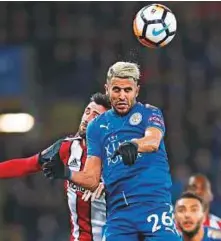  ?? Reuters ?? Leicester’s Riyad Mahrez in action with Sheffield United’s Danny Lafferty at the King Power Stadium.