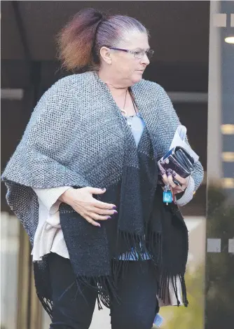  ??  ?? Mary Ann Walker leaves the Hobart Magistrate­s Court after Thursday’s sentencing hearing over the theft of gold jewellery from a couple in her care.