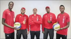  ??  ?? Qatar’s beach volleyball stars Cherif Younousse (left) and Ahmed Tija (right) with Qatar Volleyball Associatio­n officials ahead of their departure for Japan on Saturday.