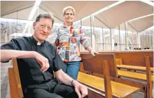  ?? THE OKLAHOMAN]
[PHOTO BY CHRIS LANDSBERGE­R, ?? The Rev. Stephen Bird and St. Patrick Catholic Church parishione­r Ann Allen pose for a photo inside the church’s sanctuary.