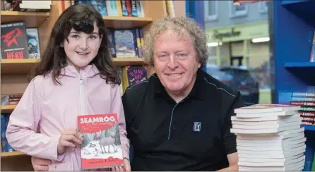  ?? Photo by Christy Riordan. ?? Peter Grogan with Lil O’Donoghue at the launch of his book, Seamróg, in Quirke’s newsagents, Cahersivee­n.