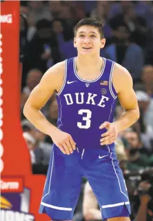  ?? Charles Rex Arbogast / Associated Press ?? Duke guard Grayson Allen likes what he sees looking up at the scoreboard late in an 88-81 win over Michigan State.