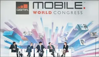  ??  ?? From left: Vittorio Colao, chief executive officer of Vodafone Group, Cesar Alierta, chief executive officer of Telefonica, Xi Guohua, chairman of China Mobile, Randall Stephenson, chairman, president and chief executive officer of AT&T, and Anne...