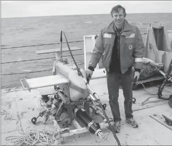  ?? HANDOUT VIA CP ?? Dave Hebert of the Fisheries and Oceans Canada poses with a survey instrument in this undated handout photo. A federal scientist says deep water off the southern coast of Nova Scotia was abnormally warm earlier this week. Scientists found water...