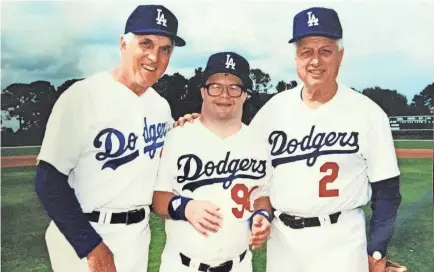  ?? “THE BEST WE’VE GOT: THE CARL ERSKINE STORY” ?? Carl Erskine, left, with son Jimmy, middle, and Tommy Lasorda.