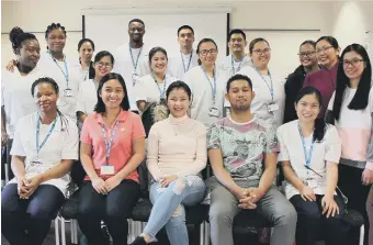  ??  ?? Three of South Tyneside and City Hospitals Sunderland NHS Foundation Trusts newest recruits from The Philippine­s, Carrie Bernasor, Erlinger Navos and Janice Tingson, seated centre, with some of the Trusts other overseas recruits