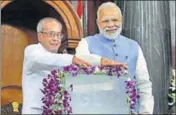  ?? PTI FILE ?? Prime Minister Narendra Modi and then President Pranab Mukherjee at the launch of goods and services tax on July 1.