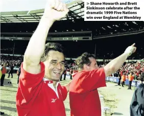  ??  ?? > Shane Howarth and Brett Sinkinson celebrate after the dramatic 1999 Five Nations win over England at Wembley