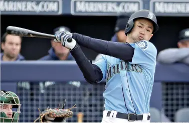  ?? AP Photo/Charlie Riedel ?? ■ Seattle Mariners’ Ichiro Suzuki bats during the third inning of a spring training game against the Oakland Athletics on Feb. 22 in Peoria, Ariz. The most decorated player ever to export his talents from Japan to the major leagues is returning home for what could be a farewell to his Hall of Fame career on both sides of the Pacific. His teammates can't wait.