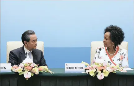 ??  ?? South Africa’s Foreign Minister Maite Nkoana-Mashabane looks at China’s Foreign Minister Wang Yi as she speaks at a press conference during the Brics foreign ministers meeting in Beijing, yesterday.
