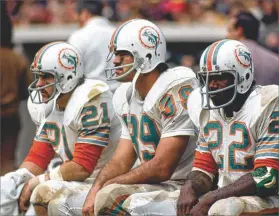  ?? TONY TOMSIC / US PRESSWIRE 1973 ?? Former Dolphins running back Jim Kiick(left) is suffering from serious cognitive problems. He is shown in 1973 with Larry Csonka (center) and Mercury Morris.
