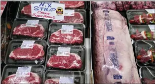  ?? CHARLES KRUPA — THE ASSOCIATED PRESS FILE ?? Beef on display in the meat department at Lambert’s Rainbow Market, in Westwood, Mass. Soaring U.S. producer prices underscore the ongoing threat to the economy from a bout of inflation that shows no sign of slowing.