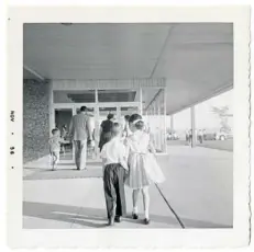  ??  ?? Mary Carr (now Mary Robb Jackson) and her brother, Jack, entering St. Gabriel of the Sorrowful Virgin School in 1956, when she was 8 and he was 6.