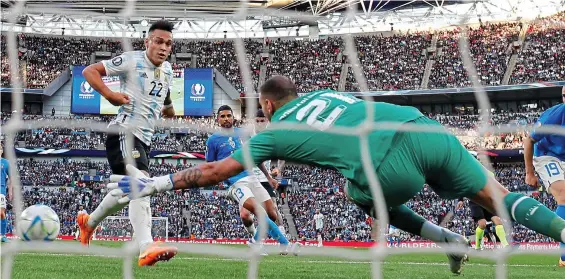  ?? GETTY IMAGES ?? Net gain: Gianluigi Donnarumma is unable to prevent Lautaro Martinez from tapping in Argentina’s opener at Wembley