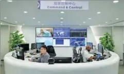  ?? PROVIDED TO CHINA DAILY ?? Employees of Internatio­nal SOS respond to emergency calls at the company’s Beijing Assistance Center in December. Ever since the COVID-19 pandemic broke out, emergency calls from Chinese companies with overseas business have been surging.