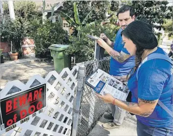  ?? Photograph­s by Mel Melcon Los Angeles Times ?? A NUMBER for L.A.’s Animal Services has been criticized for frequent busy signals, failed transfers and silent waits. Above, Gabriel Ochoa and Diana Mendoza of People for the Ethical Treatment of Animals.