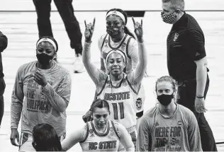  ?? Eric Gay / Associated Press ?? North Carolina State forward Jakia Brown-turner (11) leads the Wolfpack’s celebratio­n of their victory over South Florida at the Alamodome.