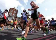  ?? MATTHIAS HANGST/GETTY IMAGES ?? Canadian marathon hope Eric Gillis, weakened by Norwalk virus, lasted 30 kilometres before pulling out at the worlds.