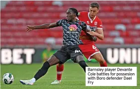  ?? ?? Barnsley player Devante Cole battles for possesion with Boro defender Dael Fry