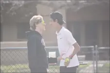  ?? JEANS PINEDA/Taos News ?? Ben Currey and opponent Ryan Sood share a laugh while changing courts in a doubles match on Thursday (April 14).